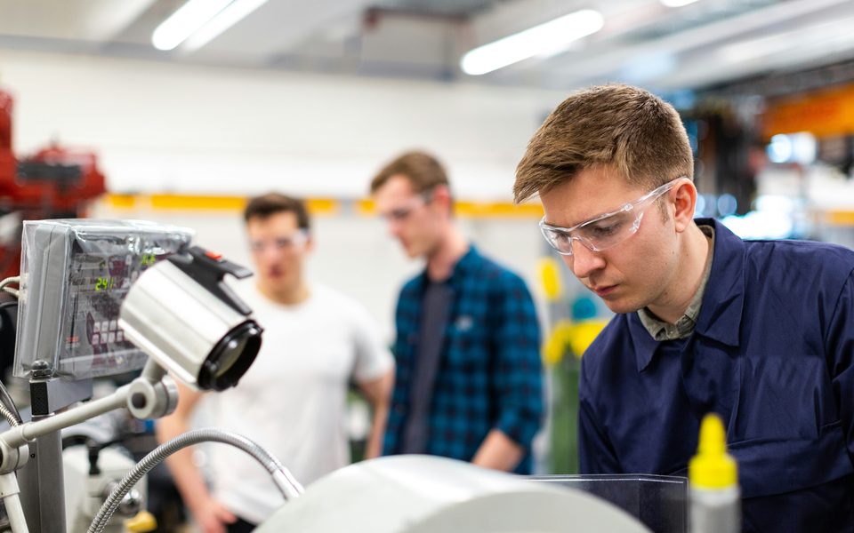 Engineer testing a prototype in a lab